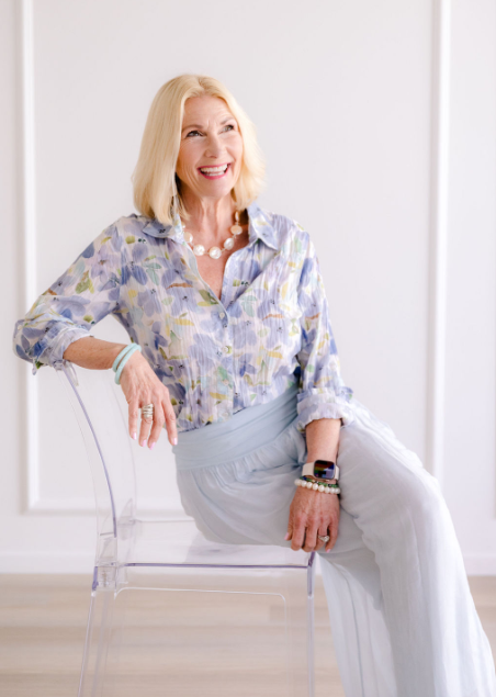 Lisa J., mindset coach, in a floral blouse